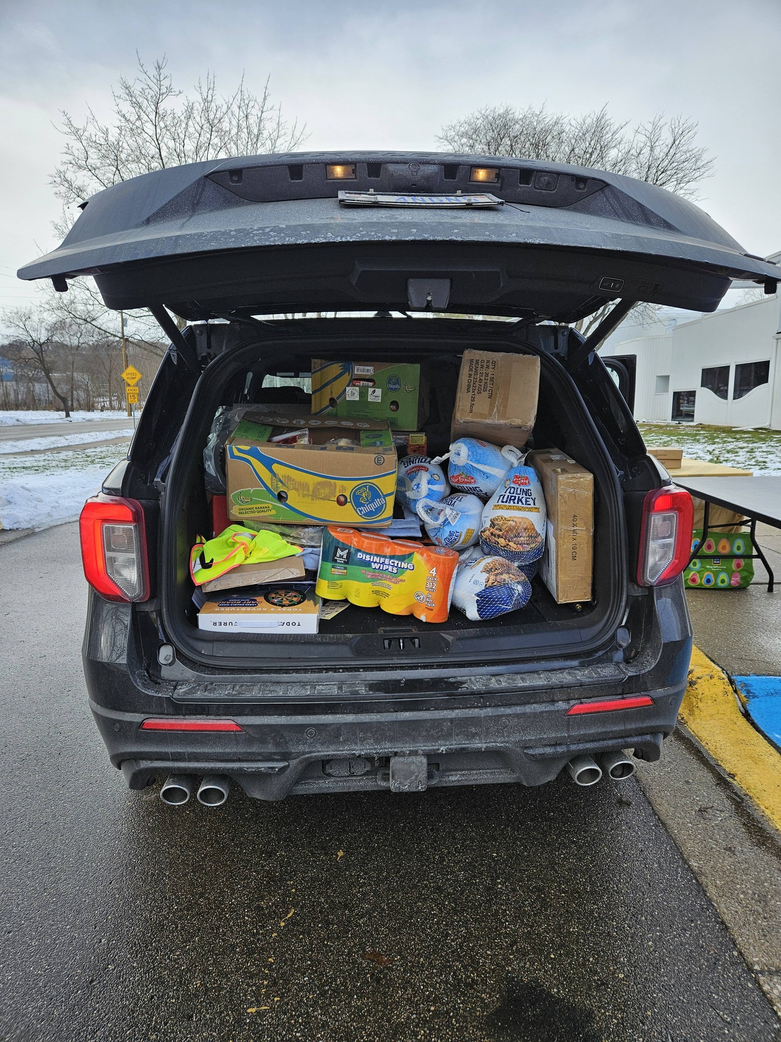 Car loaded with holiday food baskets