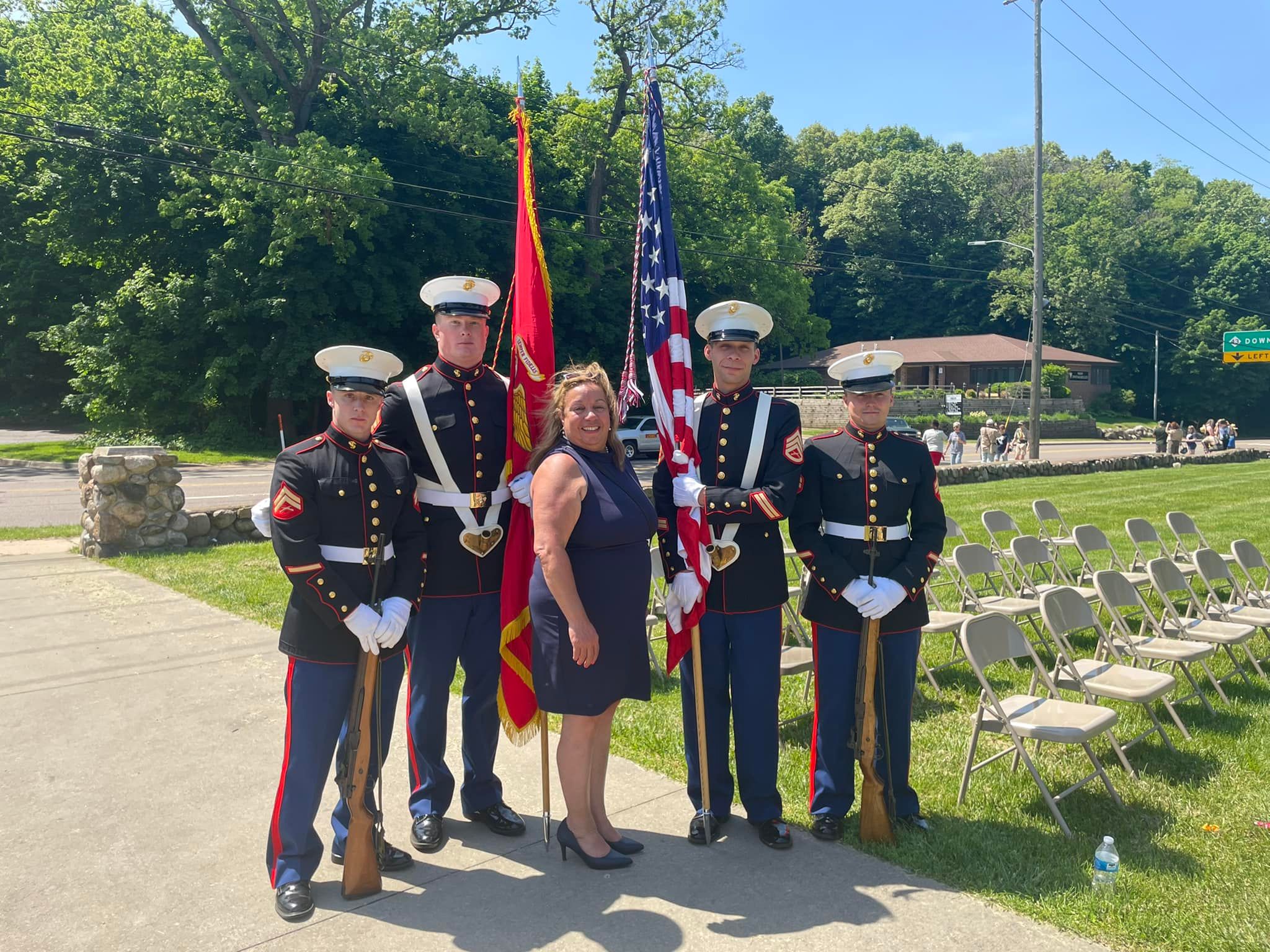Toni standing with Marines